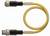Żółty, skręcony kabel z czarnymi złączami na obu końcach, przeznaczony do zastosowań przemysłowych.