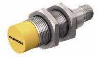 Cylindryczny wtyk przemysłowy z żółtą głowicą, z napisem 'Turck', wykonany z metalowymi rowkami gwintowanymi.