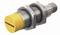 Cylindryczny wtyk przemysłowy z żółtą głowicą, z napisem 'Turck', wykonany z metalowymi rowkami gwintowanymi.