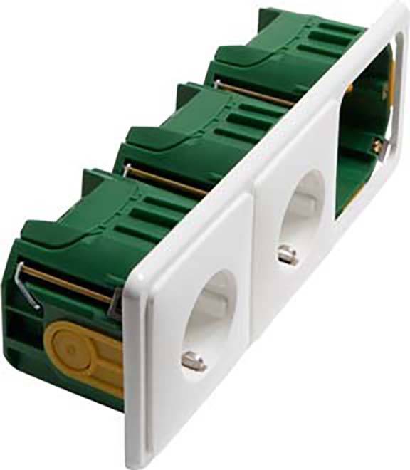 Trzy zielone gniazda elektryczne zintegrowane w białym pasku, częściowo zasłonięte; mechaniczny projekt przed procesem instalacji.