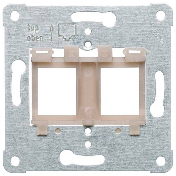Metalowa rama do mocowania włącznika lub gniazdka elektrycznego na ścianie, oznaczona napisem 'top góra' oraz strzałką kierunkową.