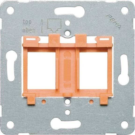 Metalowy stelaż z pomarańczowym uchwytem z tworzywa sztucznego, oznaczony napisem 'top góra' i symbolem gniazda elektrycznego, element montażowy do instalacji elektrycznej.