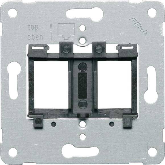 Metalowy stelaż z mocowaniem z tworzywa sztucznego, oznaczony napisem 'góra' dla prawidłowego ustawienia. Przygotowany do montażu w instalacjach elektrycznych.