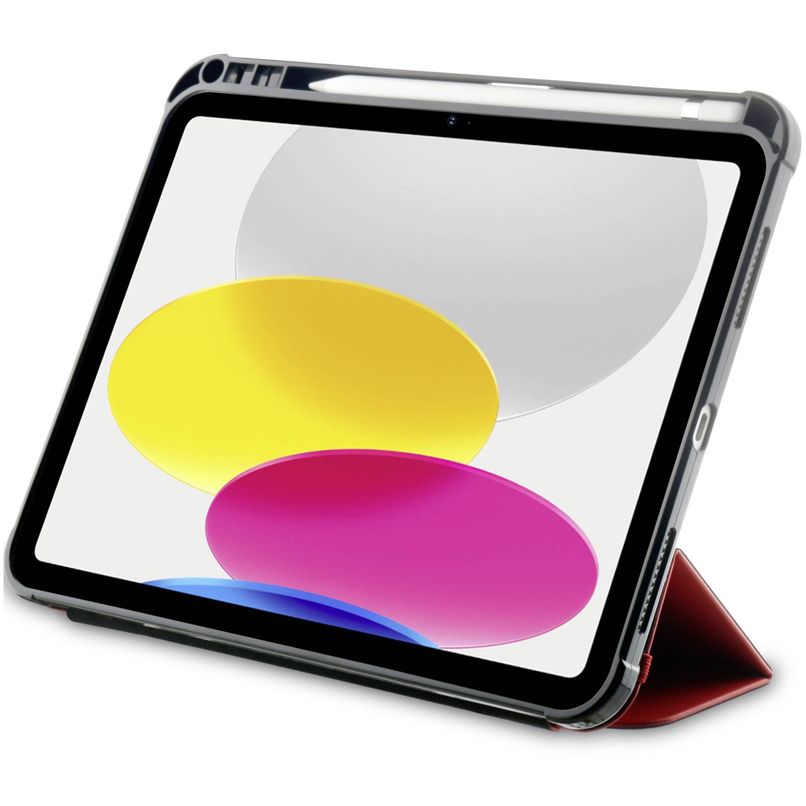 Tablet z kolorowym ekranem, wyświetlającym żółte, różowe i szare owale. Leży na czerwonym etui.