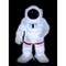 Świecąca figurka astronauty w białym skafandrze i czerwonym pasie stoi na czarnym tle.