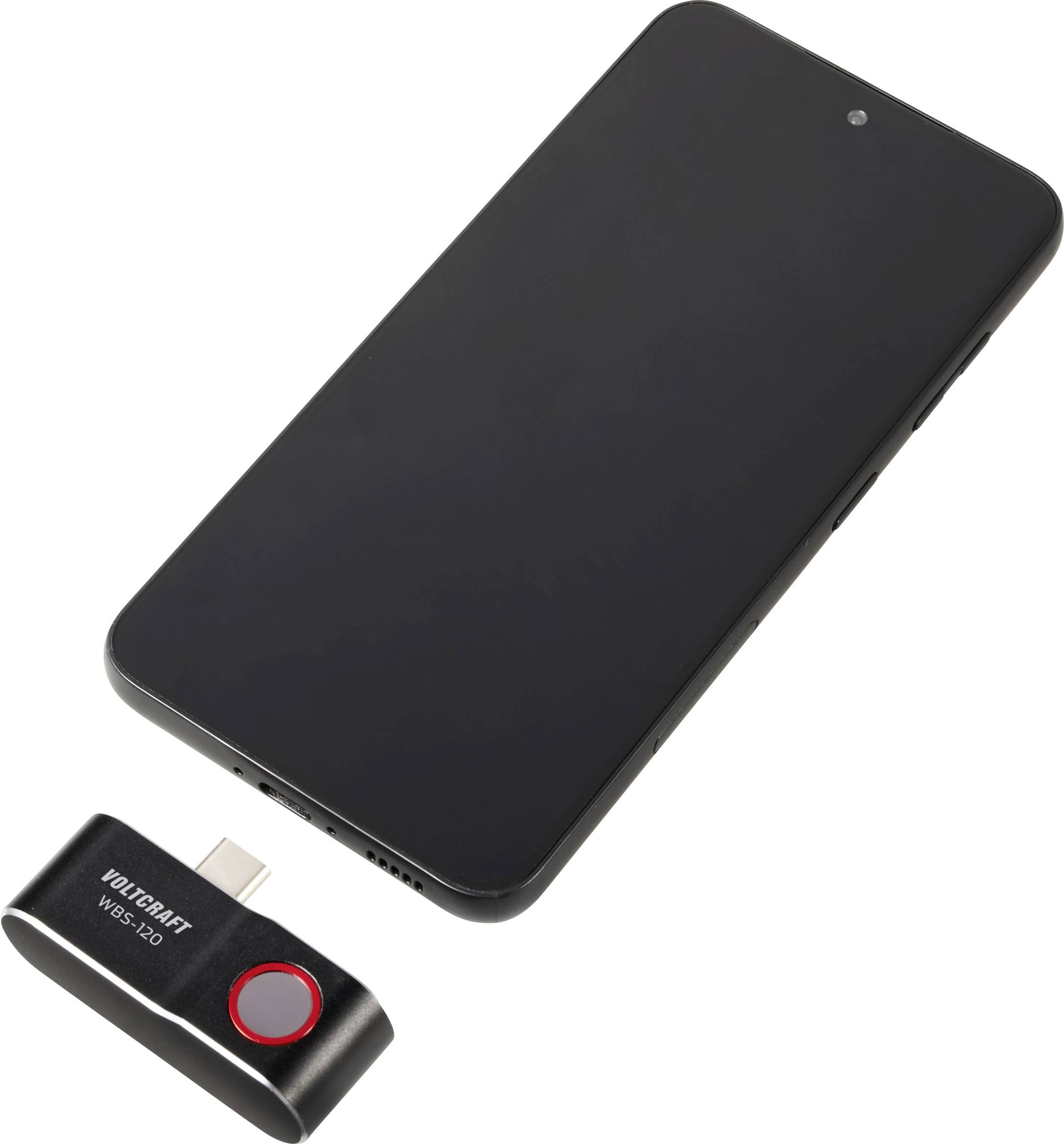 Smartfon obok urządzenia USB z napisem 'VOLTCraft WBS-210'.