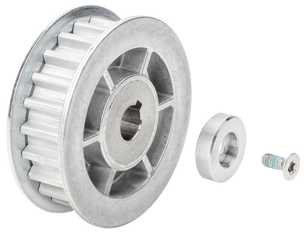 Metalowa tarcza i koło zębate z otworem pośrodku, obok mniejsza tarcza i śruba. Komponenty do budowy maszyn.
