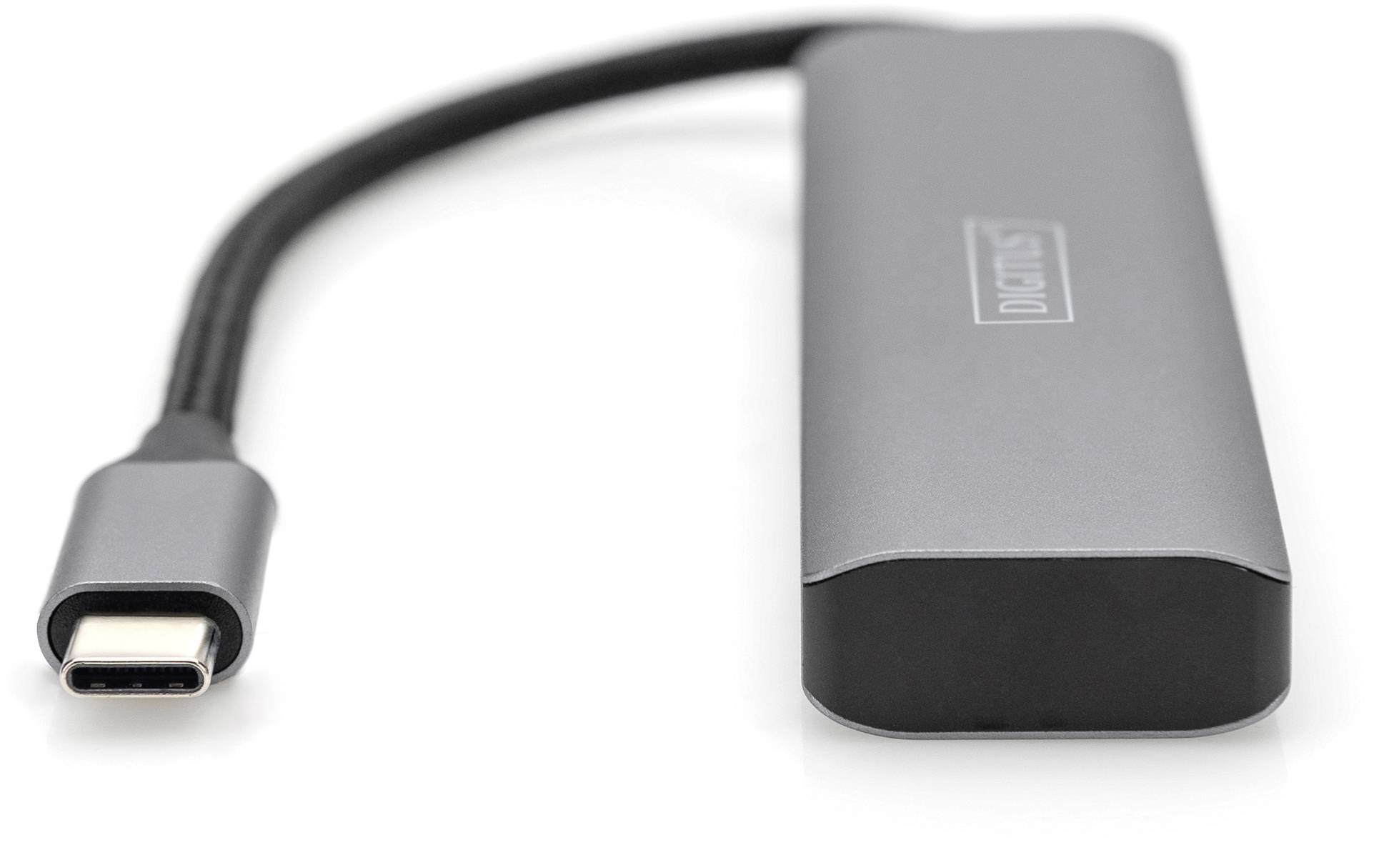 Szary ładowarka USB-C z wbudowanym przewodem, leżąca na płaskiej powierzchni. Idealna do szybkiego ładowania i przesyłu danych.