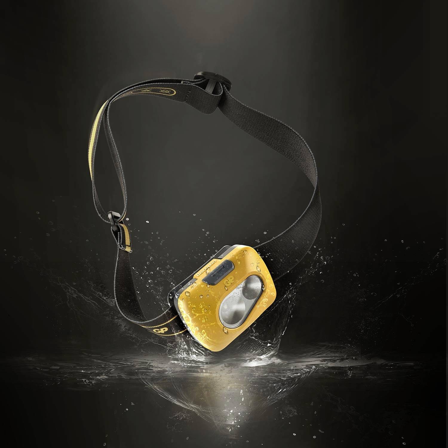 Czołówka z żółtą obudową i regulowaną czarną opaską, odporna na zachlapania. Odpowiednia do aktywności na świeżym powietrzu.