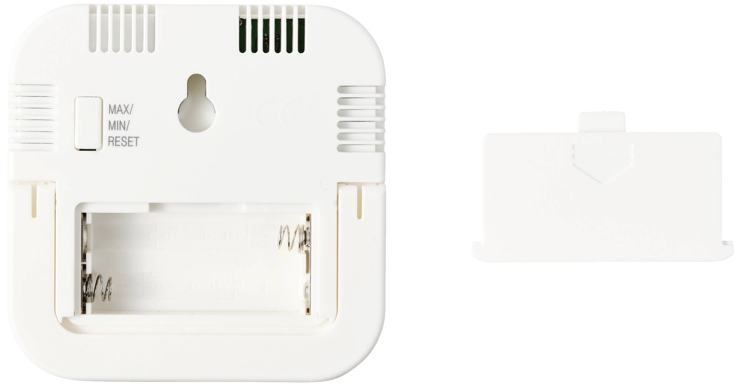 Tylna strona białego urządzenia zasilanego bateryjnie z komorą baterii po lewej stronie i zdejmowaną pokrywą po prawej stronie.