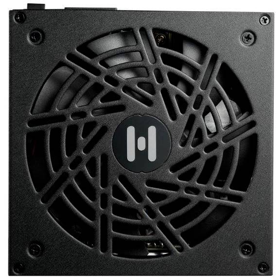 Czarny zasilacz komputerowy z dużymi otworami wentylacyjnymi i charakterystyczną kratką wentylatora pośrodku.