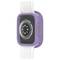 Smartwatch z fioletową obudową ochronną i białym paskiem, z fokusem na tylną część z czujnikami i napisem.