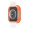 Smartwatch w pomarańczowej obudowie i białym pasku. Widoczna jest jej tylna strona z czujnikami i oznakowaniami.