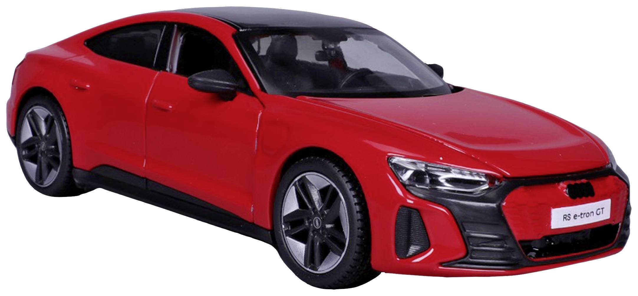 Czerwony samochód, prawdopodobnie model Audi, stoi skośnie, zwrócony lekko do przodu. Posiada sportowy, aerodynamiczny design.