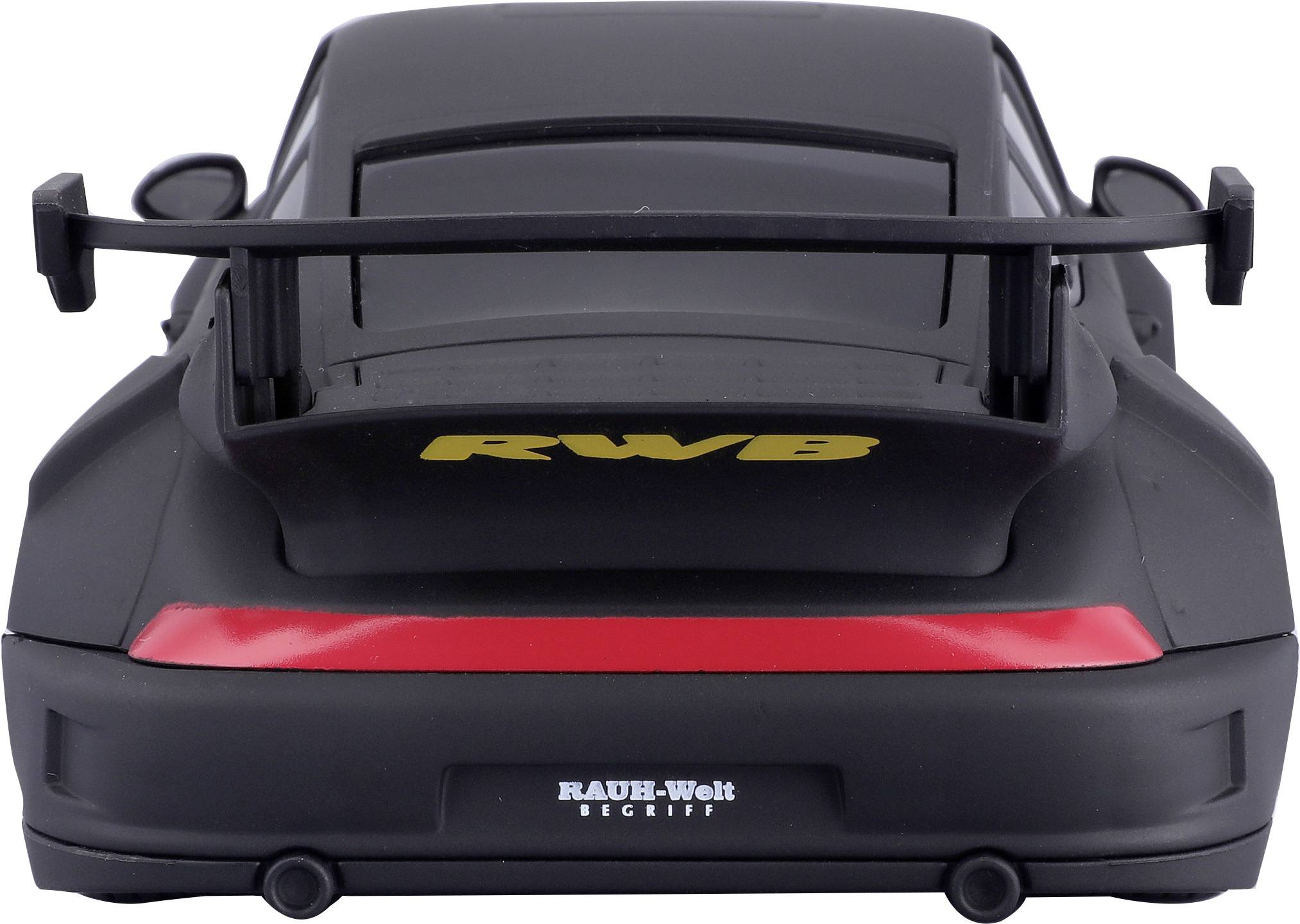 Czarny model samochodu sportowego widziany od tyłu, z dużym tylnym skrzydłem i czerwonym paskiem. Napis 'RAUH-Welt BEGRIFF'.