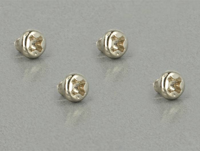 'Trzy śruby ze stali nierdzewnej na szarym tle, ułożone symetrycznie.'