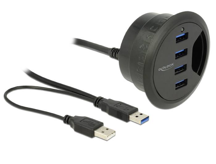 Okrągły, czarny hub USB z trzema portami USB 3.0, wbudowany w stół. Obok leżą dwa kable USB.
