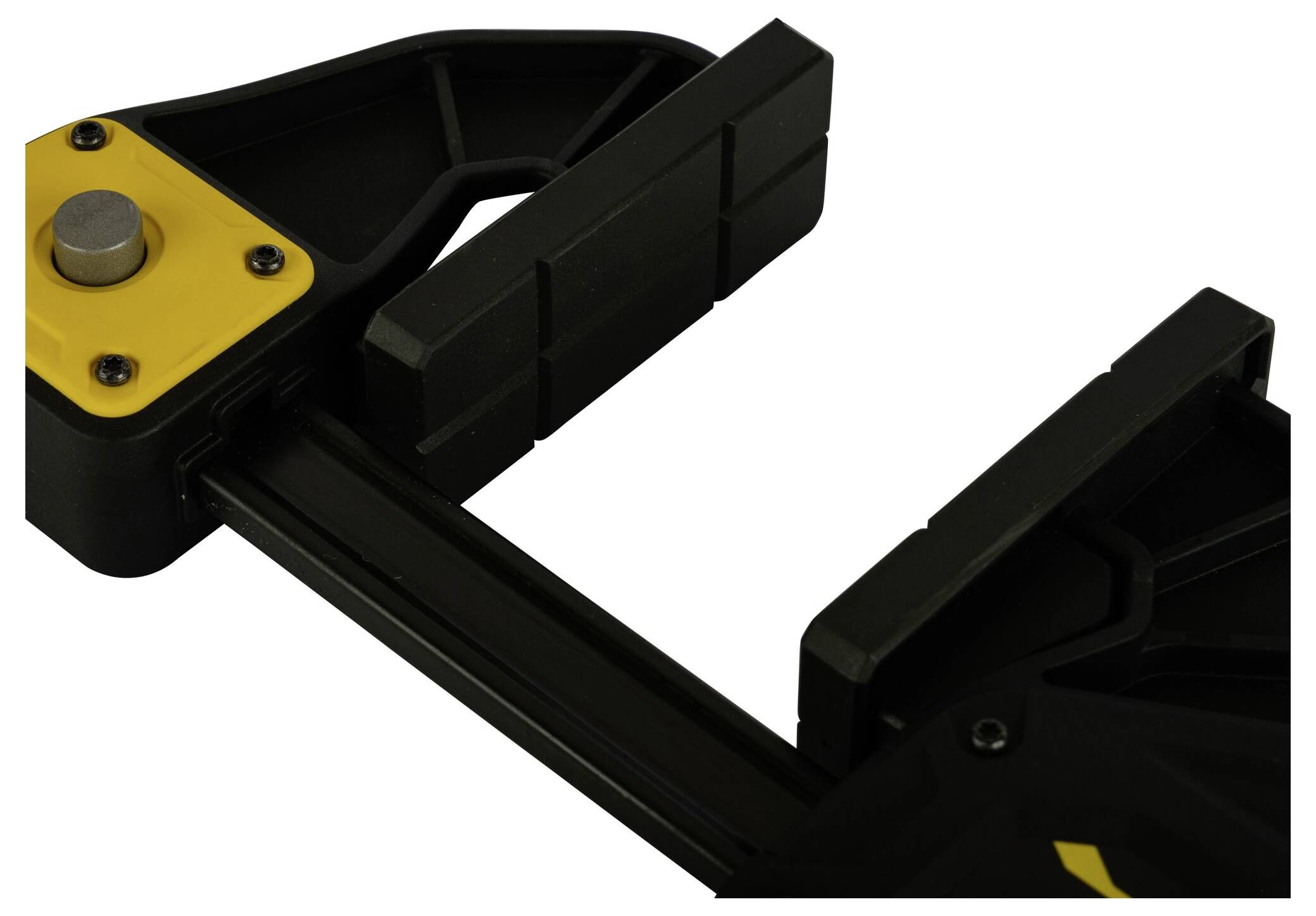 Czarna i żółta ścisk śrubowy z szczękami z tworzywa sztucznego, częściowo rozwarty.