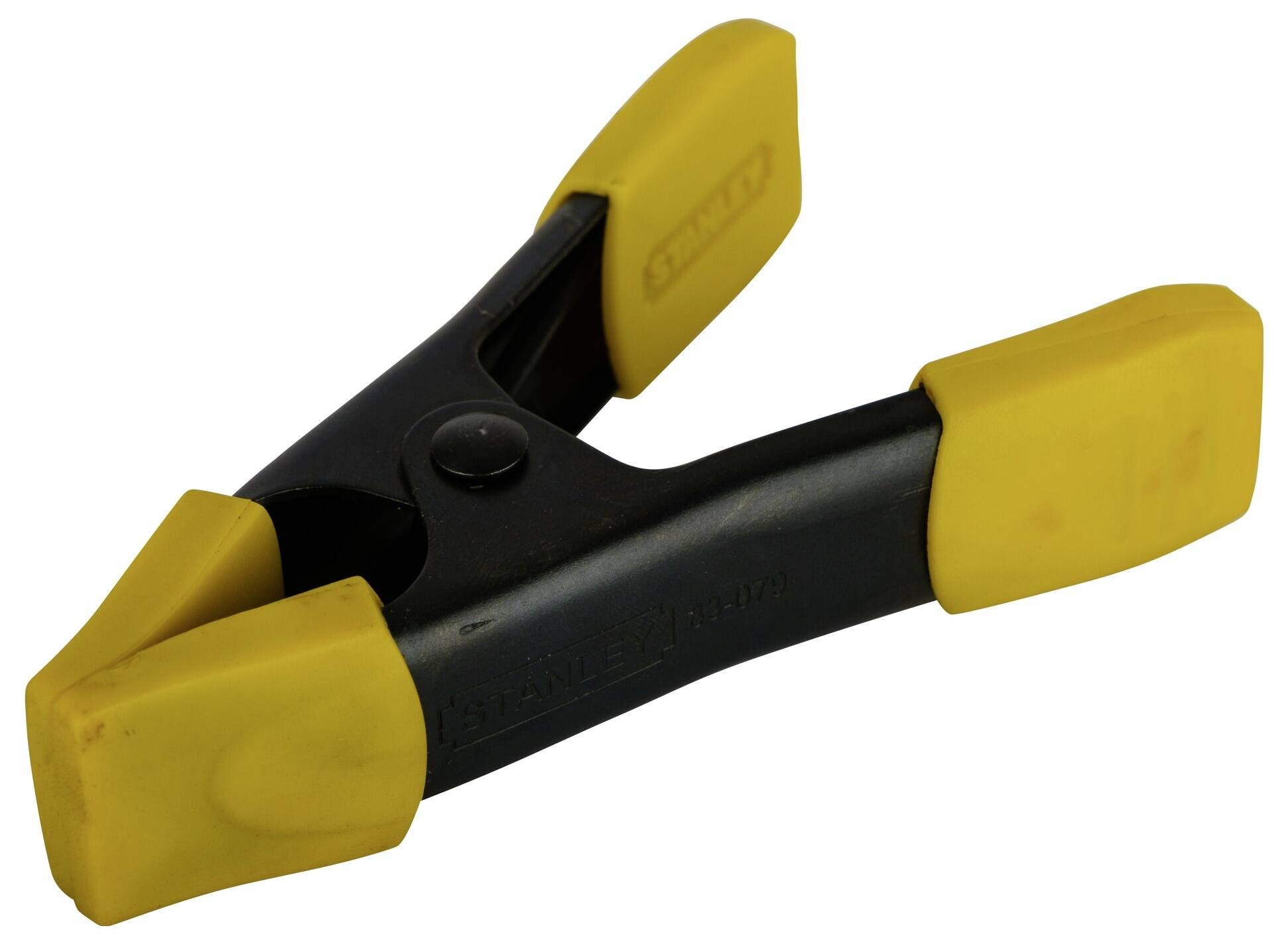 Żółty plastikowy klips z czarną rączką.