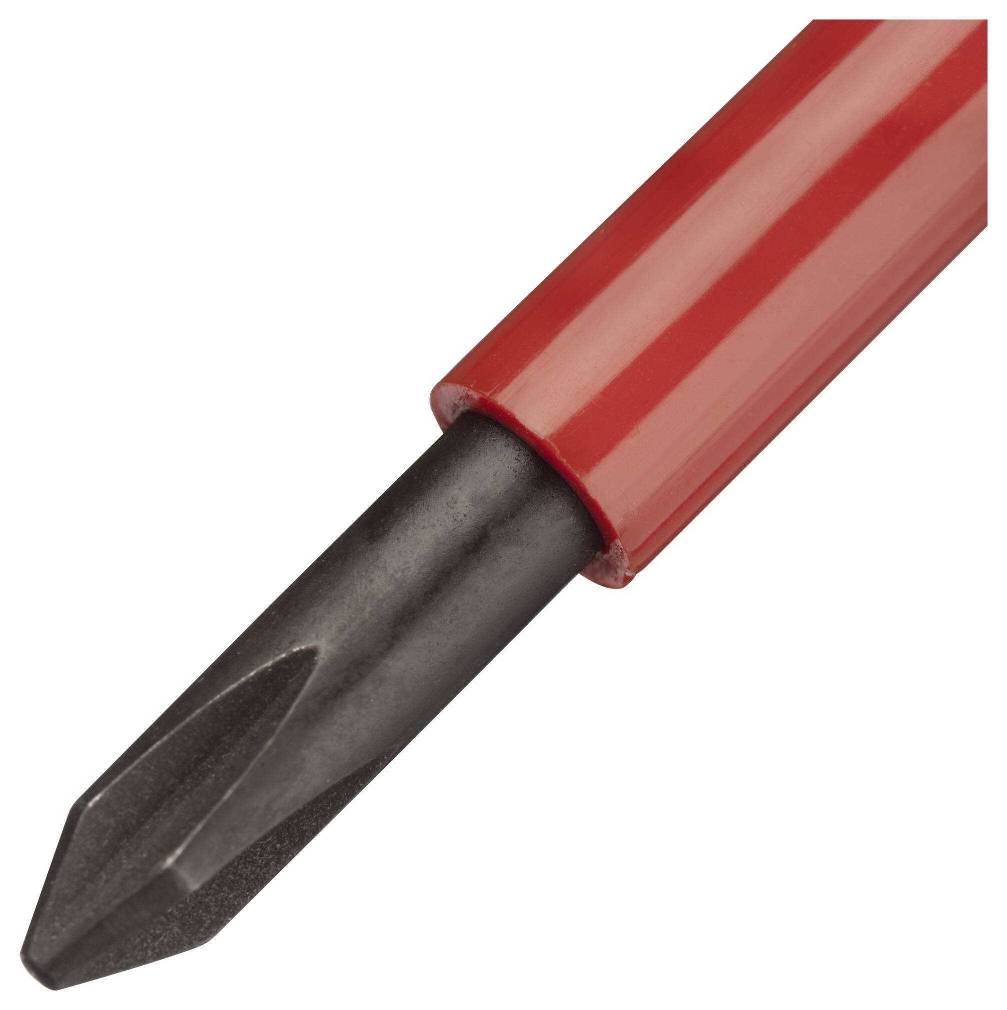 Wkrętak krzyżowy z czerwonym uchwytem, zbliżenie końcówki.