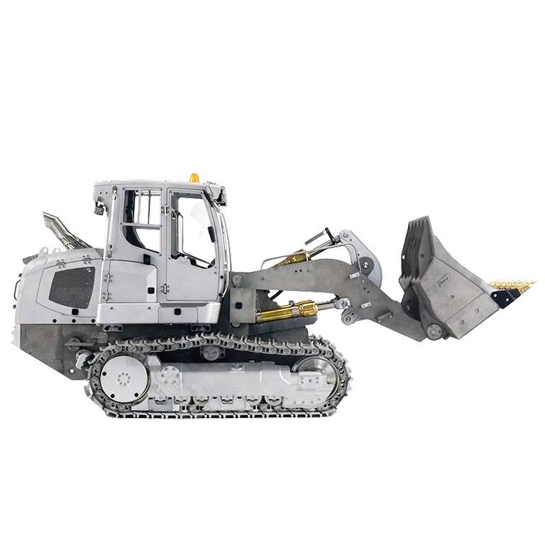 Pojazd gąsienicowy widziany z boku z ładowarką czołową, nadający się do prac budowlanych w trudnym terenie.