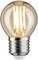 Żarówka z rozświetlonymi włóknami i metalową oprawką, emitująca ciepłe, żółte światło.