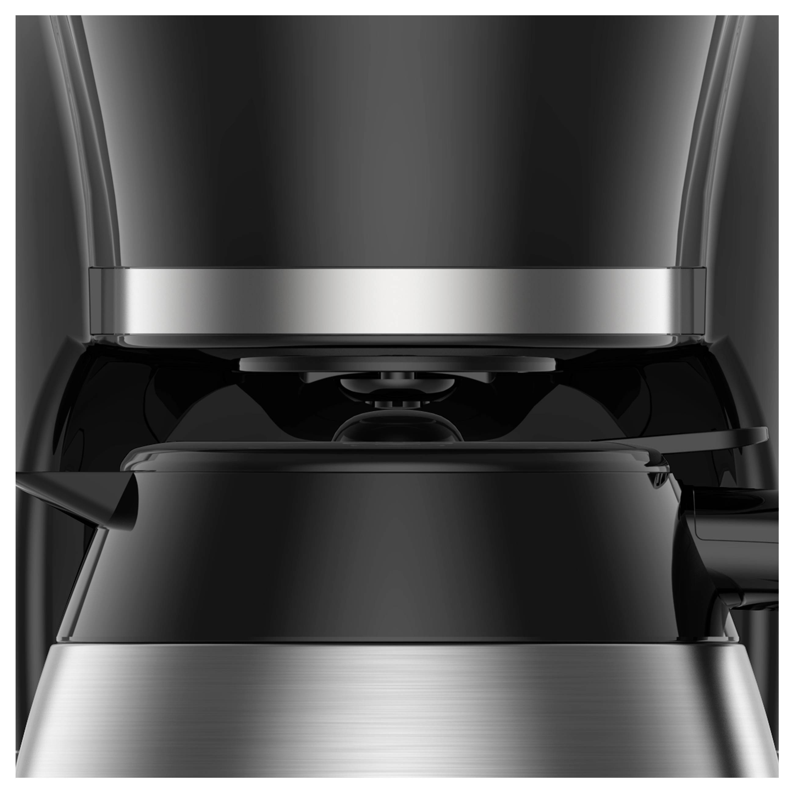 Elegancka czarna i ze stali nierdzewnej ekspres do kawy o nowoczesnym designie, pokazujący głowicę do parzenia i część karafki poniżej.