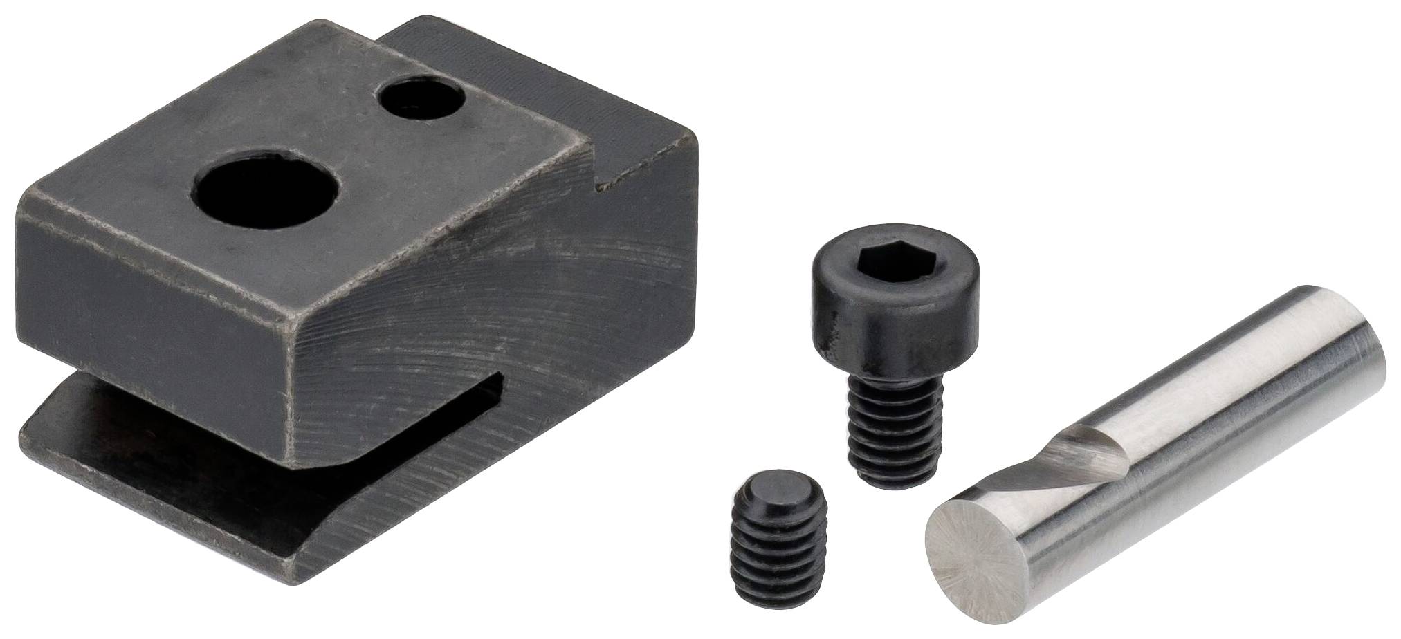 Czarny metalowy blok z dwoma otworami, obok niego dwie śruby o różnych rozmiarach i cylindryczny kawałek metalu.
