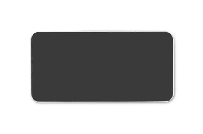Jasnoszara prostokątna powierzchnia, prawdopodobnie powierzchnia magnetyczna, na ciemnym tle.
