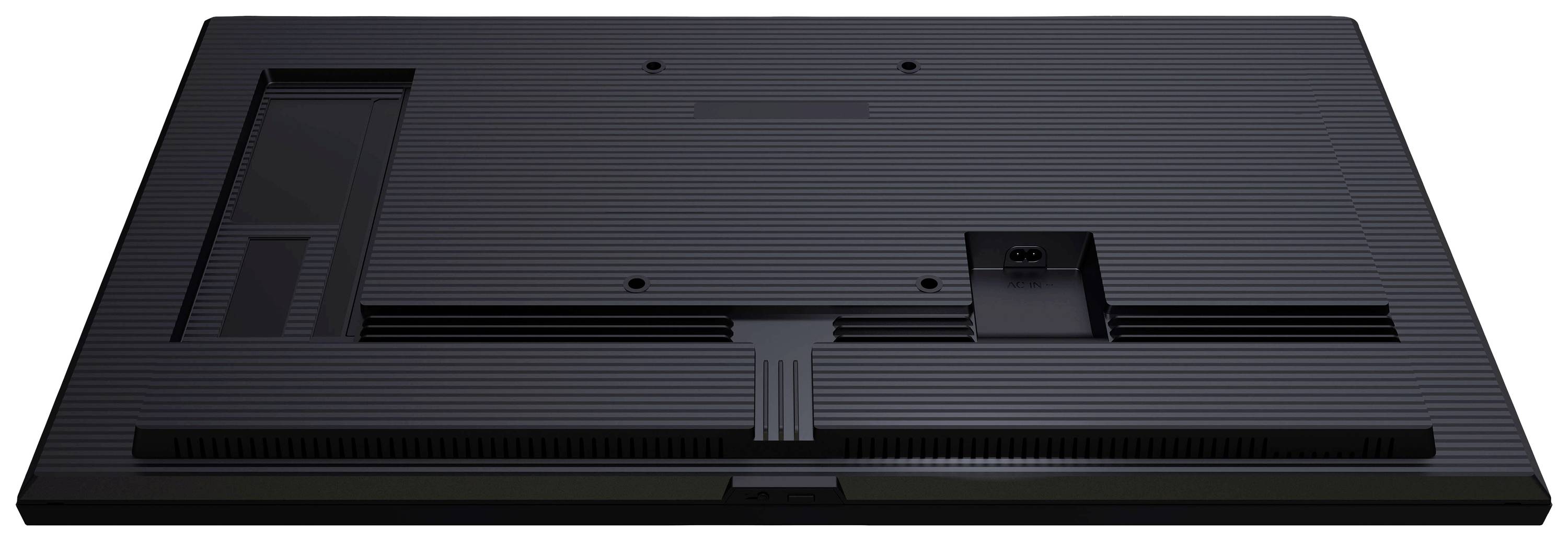 Spód nowoczesnego telewizora z wieloma otworami wentylacyjnymi i gniazdami przyłączeniowymi na czarnym tle.