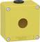 Żółta obudowa firmy Schneider Electric z okrągłym otworem pośrodku i śrubami w narożnikach.