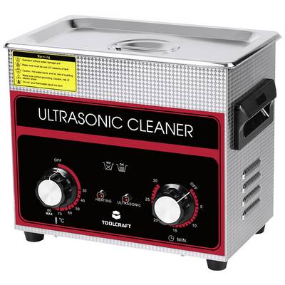 Urządzenie do czyszczenia ultradźwiękowego z przyciskami do regulacji temperatury i timera. Czarny front z czerwonym napisem 'Ultrasonic Cleaner'.