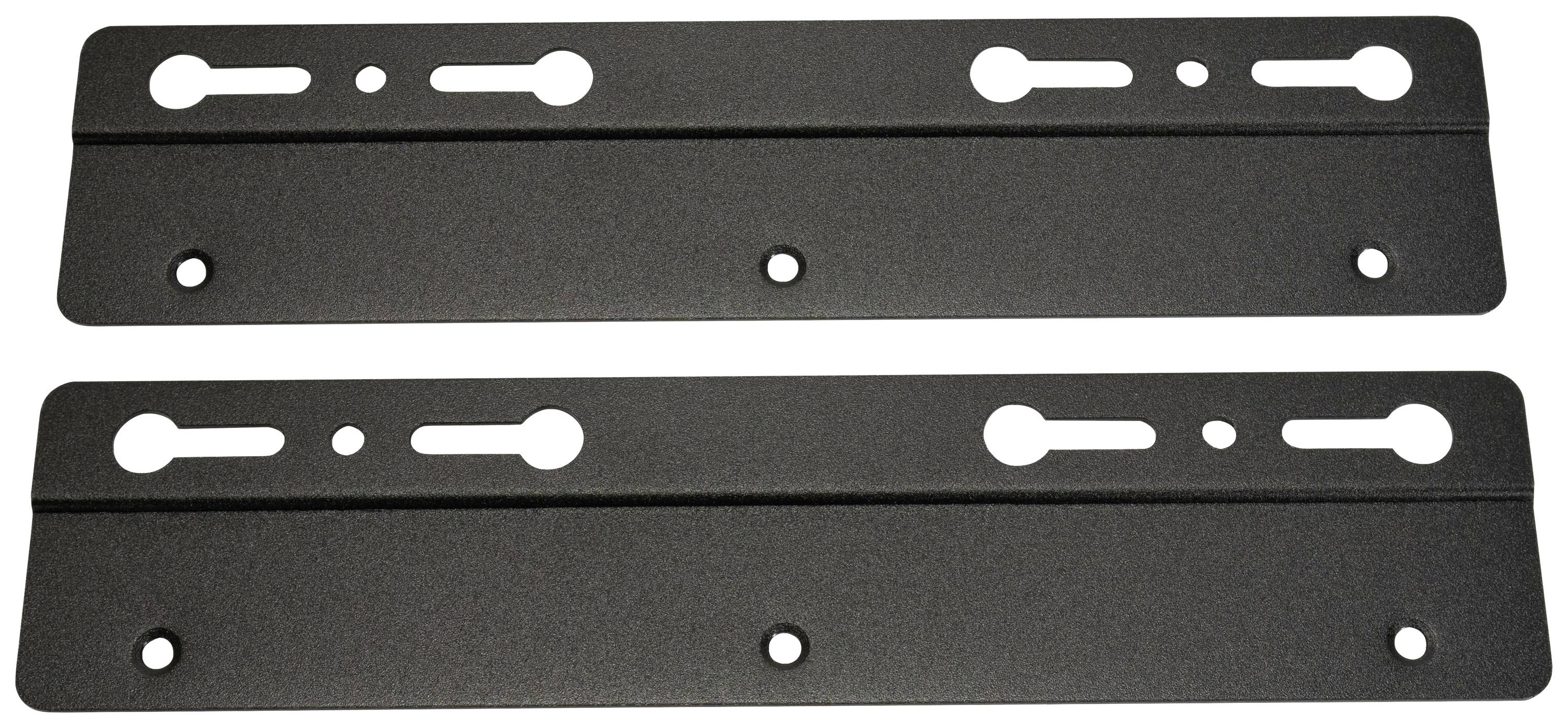 Dwie czarne metalowe płyty z wieloma otworami i szczerbami, prawdopodobnie uchwyty do montażu ściennego lub mocowania innych obiektów.