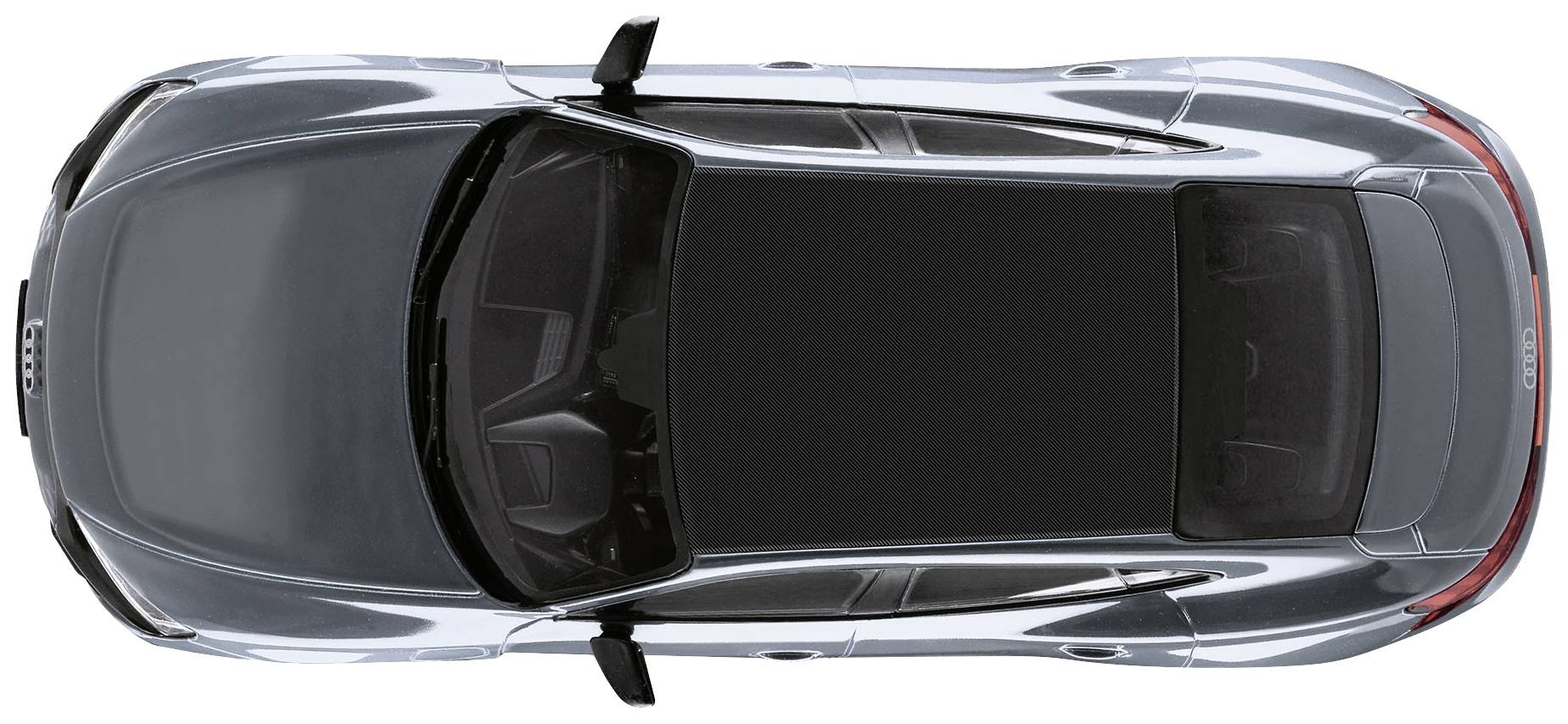 Srebrny samochód widziany z góry. Wyraźnie widoczny dach i okna.