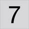 Duża czarna cyfra 7 wycentrowana na jasno szarym tle.