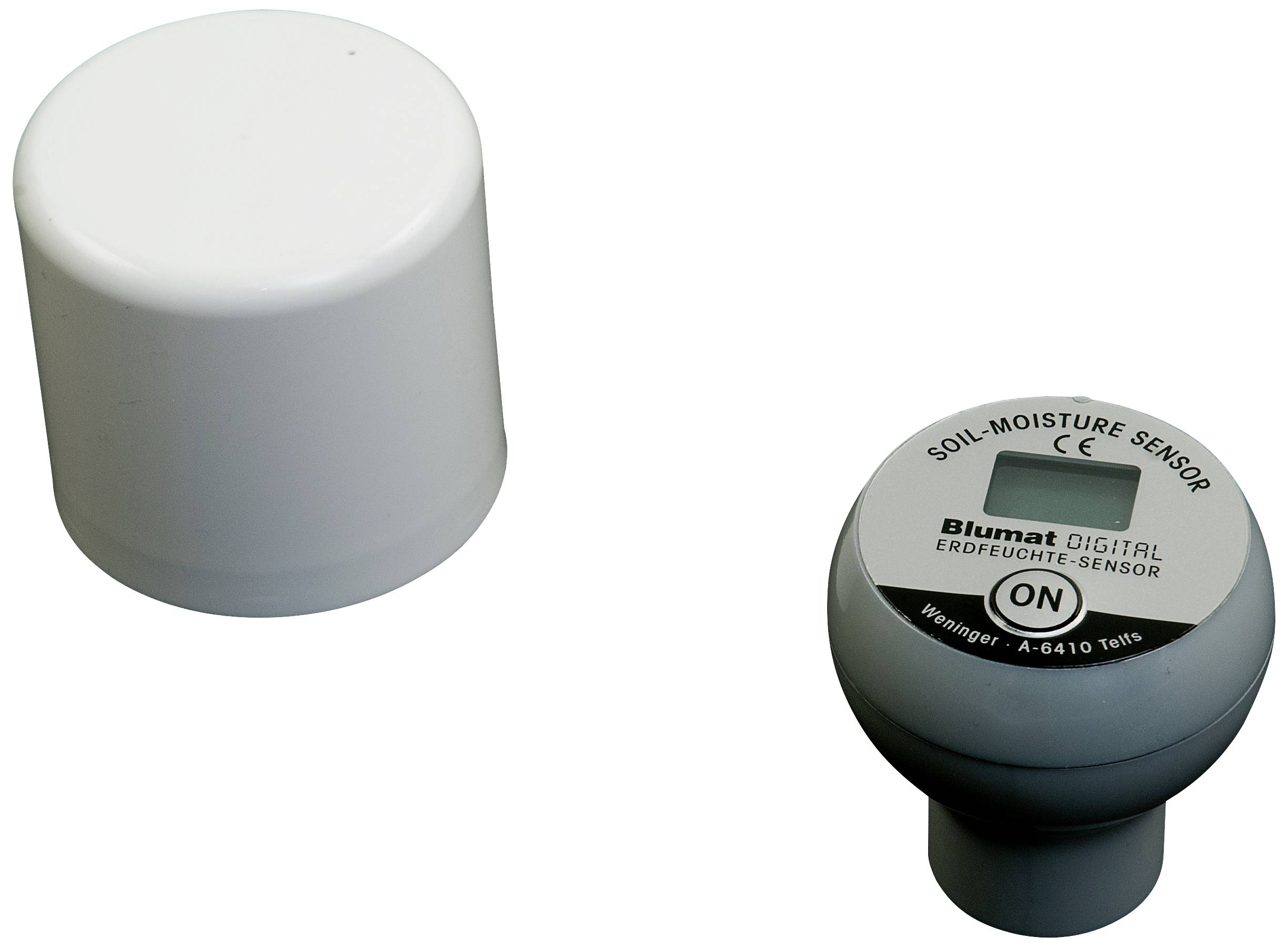 Czujnik wilgotności gleby z plastikową osłoną. Napis: 'CZUJNIK WILGOTNOŚCI GLEBY' i 'WŁ.'. Widoczna nazwa marki i numer modelu.