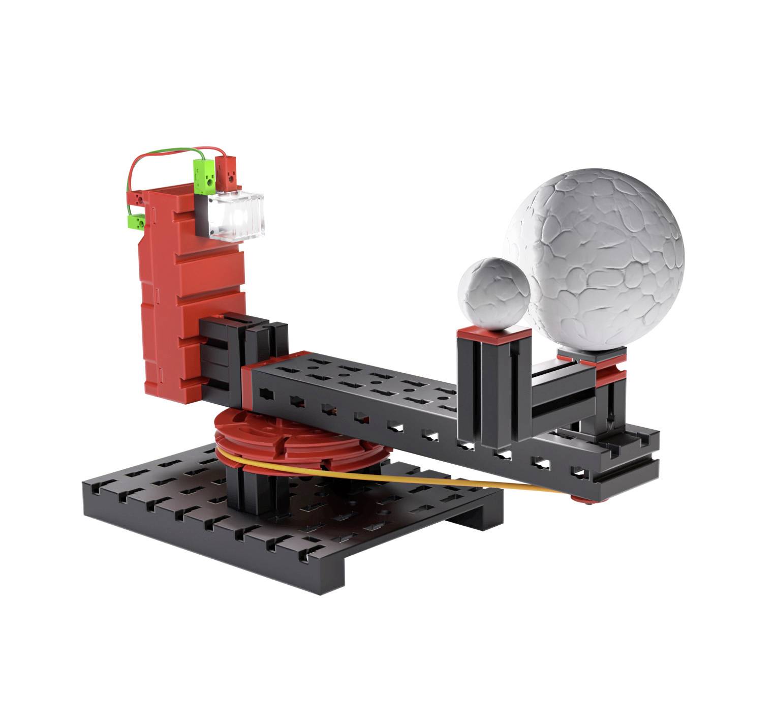 Model urządzenia obrotowego z dwiema kulami o różnych rozmiarach. Urządzenie ma czerwone i czarne zabarwienie.