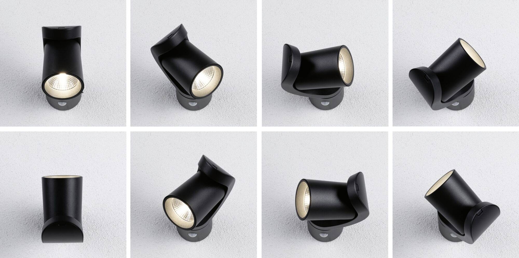 Osiem czarnych, regulowanych kinkietów ustawionych pod różnymi kątami na jasnoszarym tle.