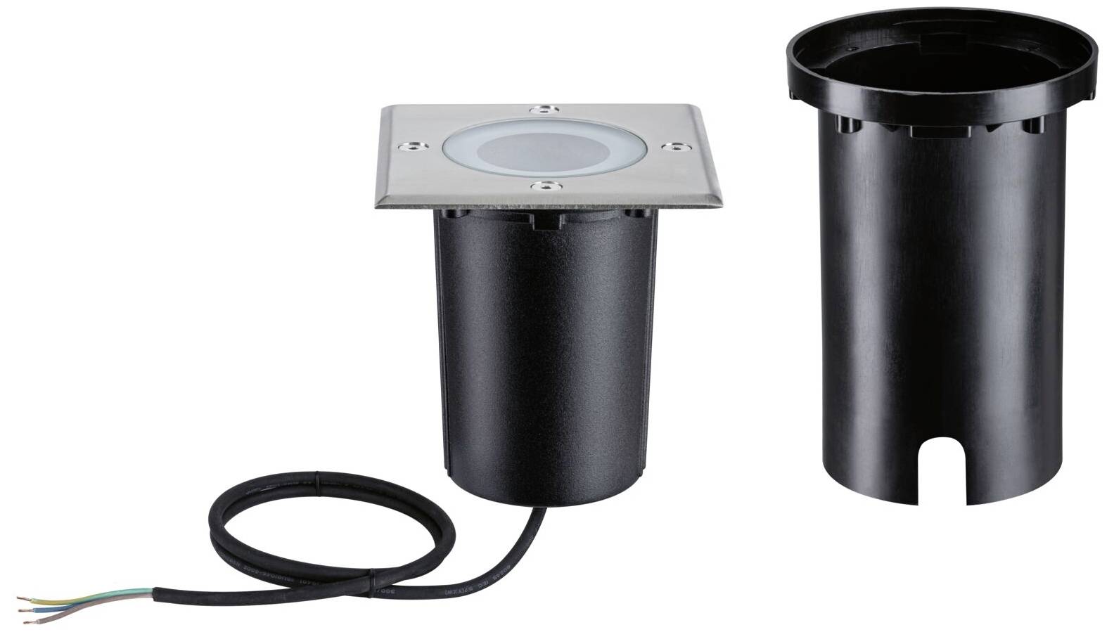 Oprawa najazdowa z czarną obudową i przewodem, umieszczona obok osobnego kontenera gruntowego. Idealna do oświetlenia zewnętrznego.