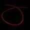 Świecąca, zakrzywiona czerwona linia na czarnym tle.