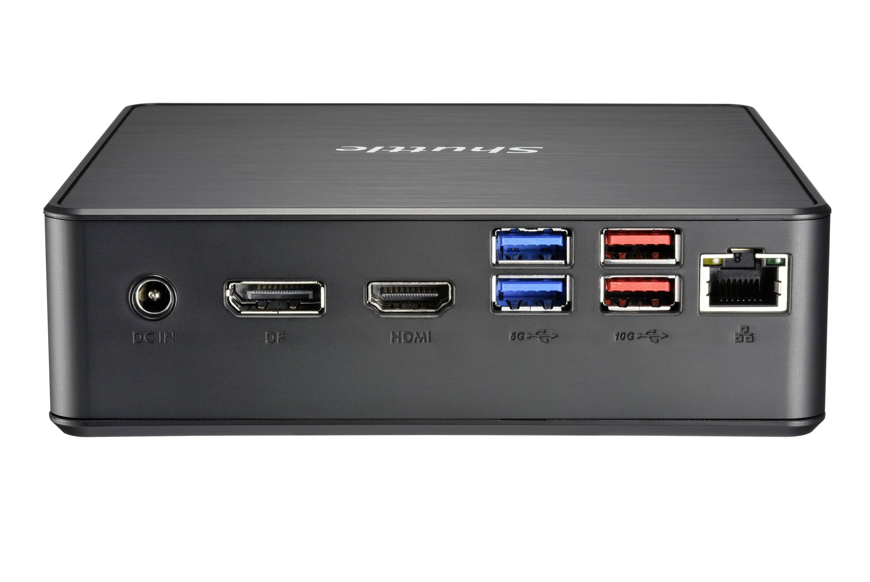 Czarny mini-komputer z różnymi złączami: złącze zasilania, DisplayPort, HDMI, porty USB w kolorach niebieskim i czerwonym, Ethernet.