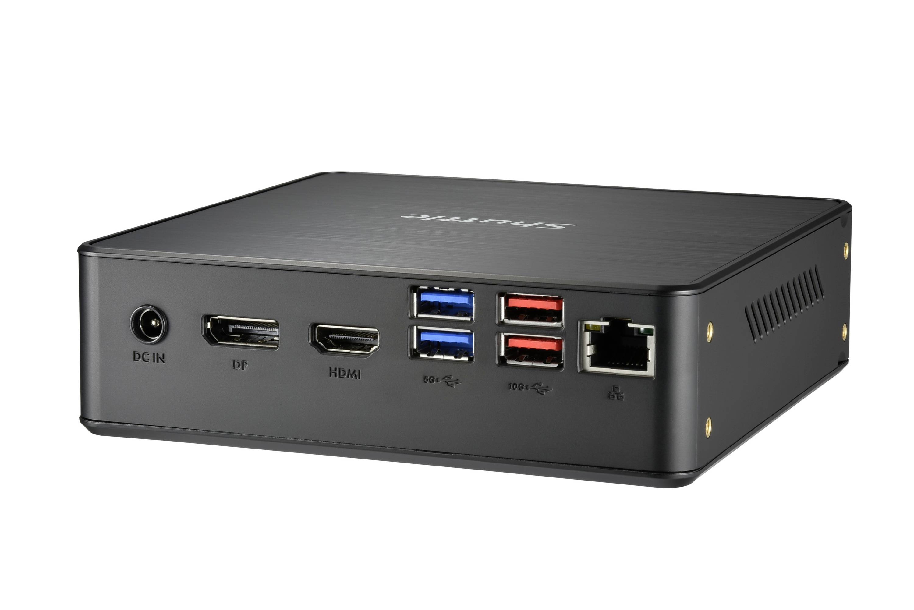 Czarny mini-komputer z wieloma portami, w tym USB, HDMI i Ethernet, na białym tle.