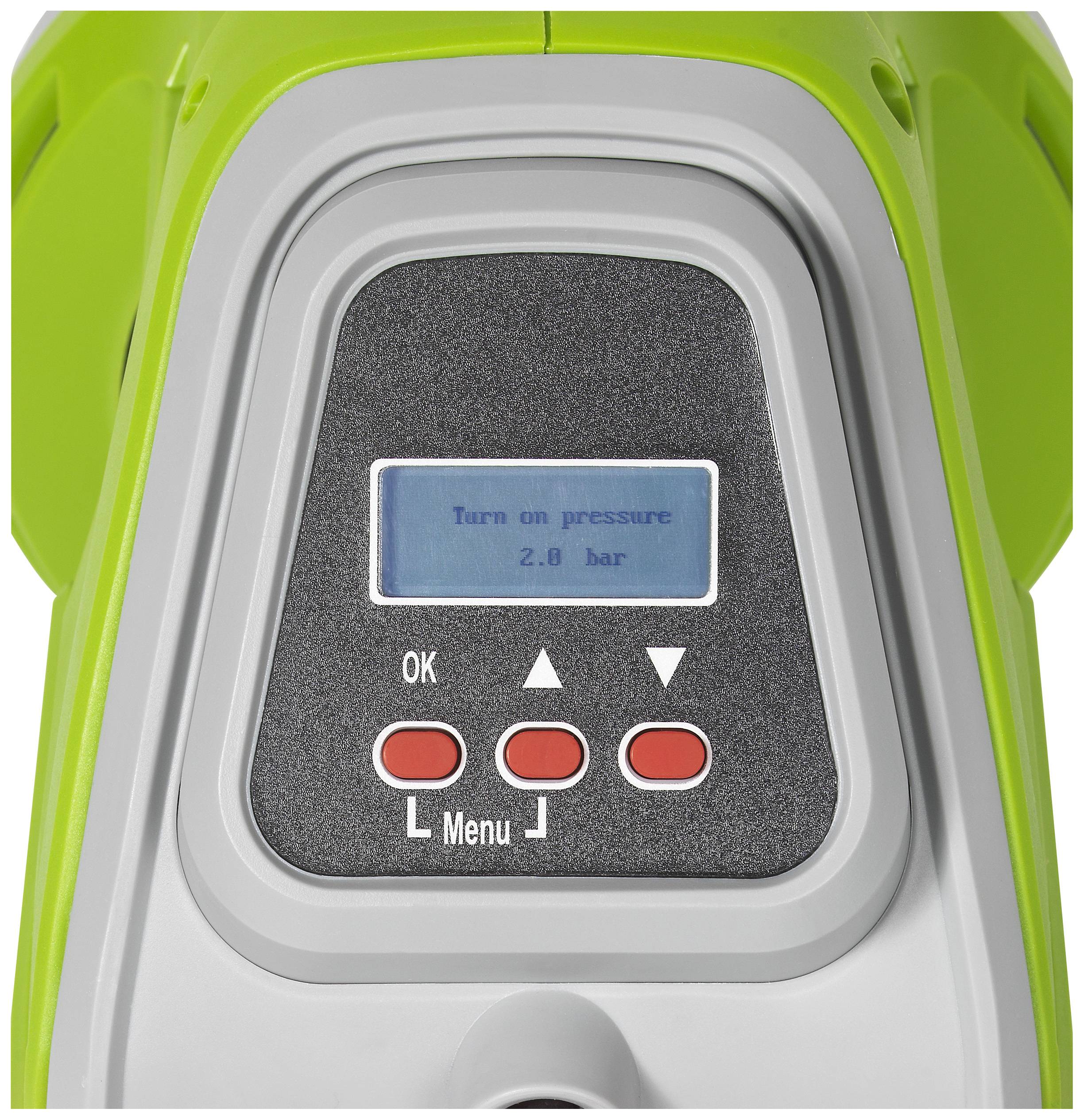Obraz zielonego urządzenia elektronicznego z wyświetlaczem. Na ekranie widnieje napis: 'Włącz ciśnienie 2,8 bara'. Poniżej znajdują się dwa czerwone przyciski i jeden czarny.