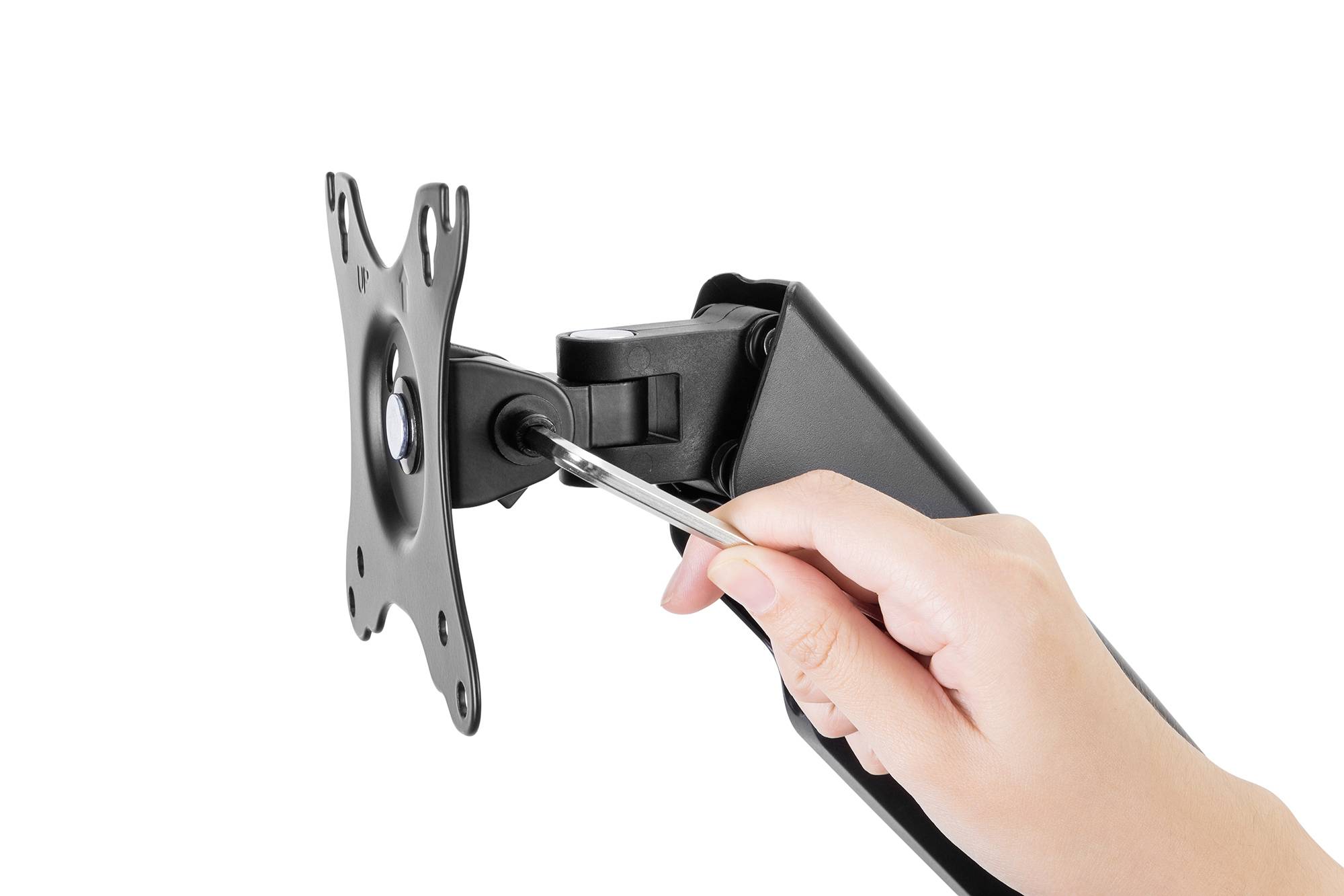 'Ręka reguluje uchwyt monitora za pomocą klucza nastawnego.'