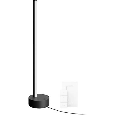 Czarna pionowa lampa LED stojąca z okrągłą podstawą i pilotem; nowoczesny, minimalistyczny design.