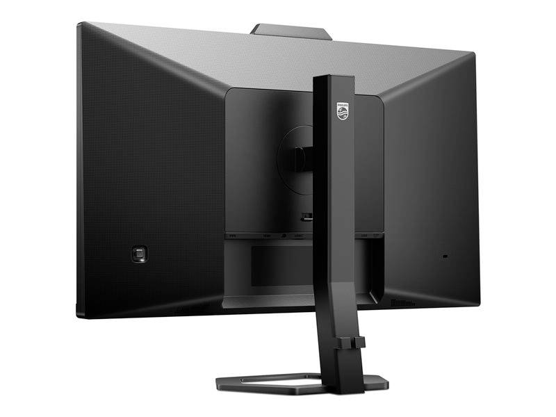 Widok z tyłu czarnego monitora komputerowego z prostokątną podstawą, stojącego na stole.