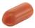 Czerwona, wydłużona kapsułka na białym tle.