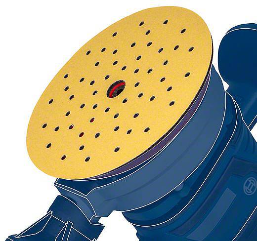 Maszyna szlifierska z żółtą tarczą szlifierską, posiadającą wiele małych otworów, jest przedstawiona w zbliżeniu.