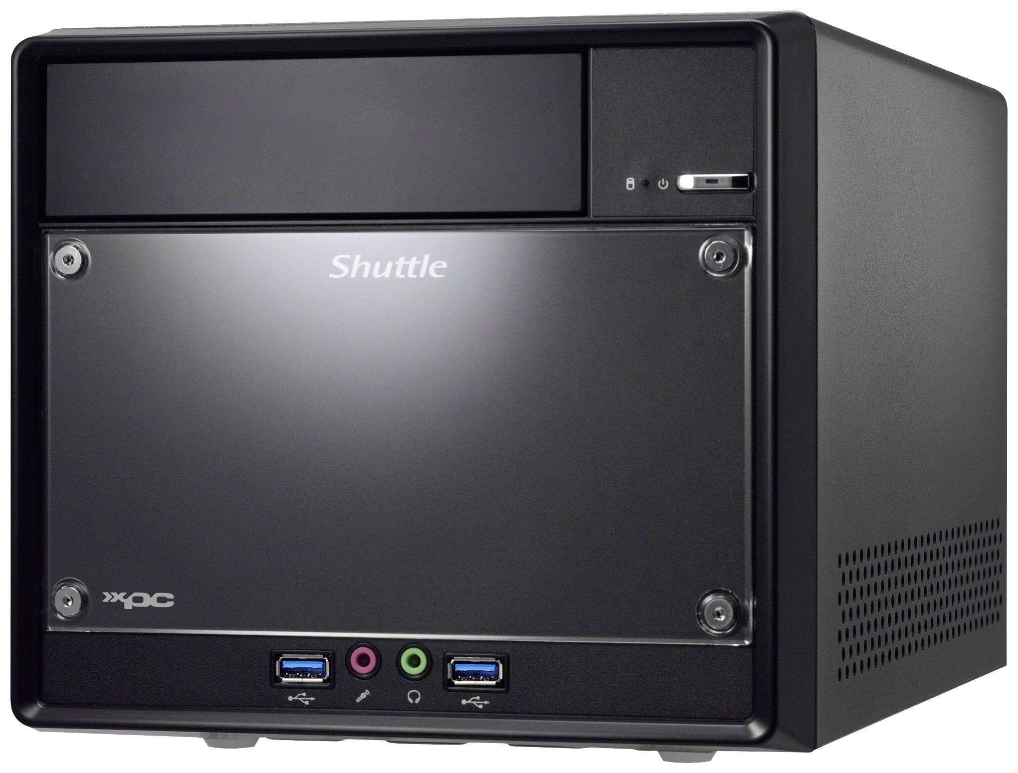 Czarny, prostokątny minikomputer z napisem 'Shuttle' na przedniej płycie. Dostępne złącza USB i audio.