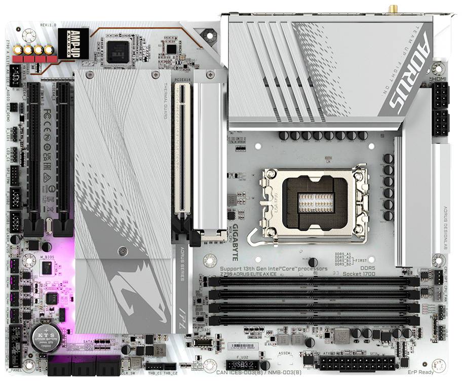 Płyta główna o srebrnym designie z wieloma slotami RAM i portami. Widoczne logo 'AORUS'.